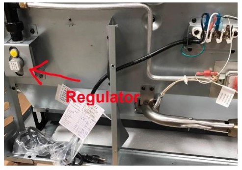 Regulator location on rear of stove